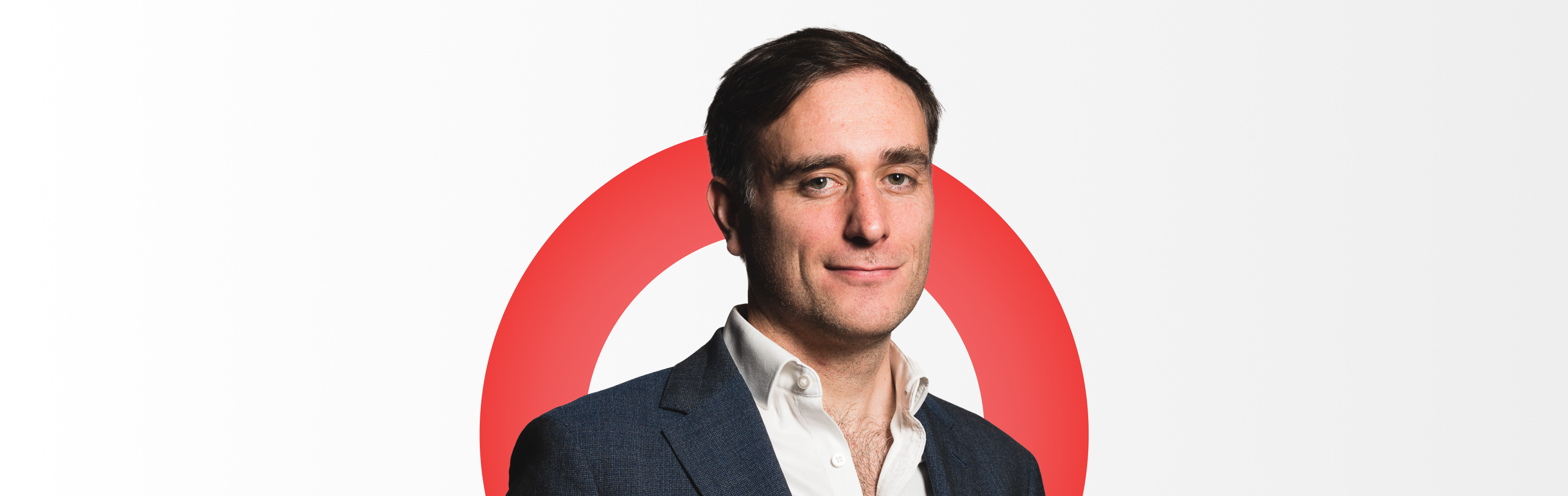 A corporate headshot of Kenneth Lamont, Senior Analyst in the Manager Research team at Morningstar. Kenneth is wearing a grey blazer and white shirt.